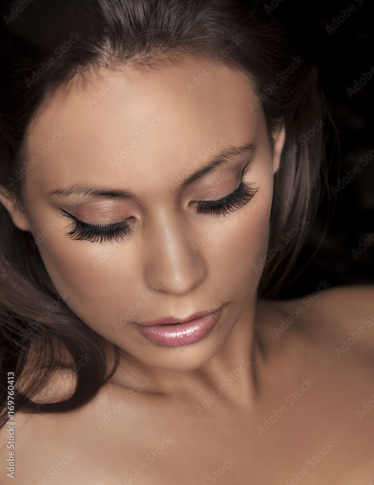 Obraz premium Beautiful womans face eye makeup and lashes
