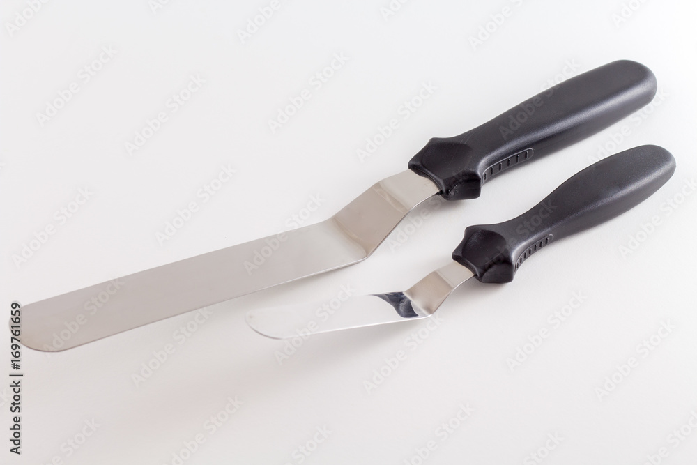 Spatula or Cake scraper for scraping fondant or icing on cake pastry of pie isolated on white background Spatula or Cake scraper for scraping fondant or icing on cake pastry of pie isolated on white background