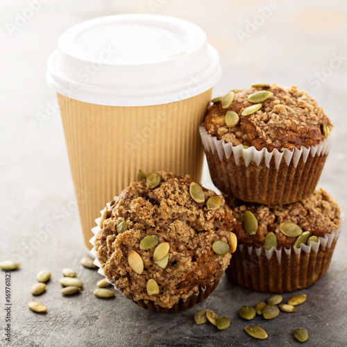 Healthy pumpkin muffins with coffee to go