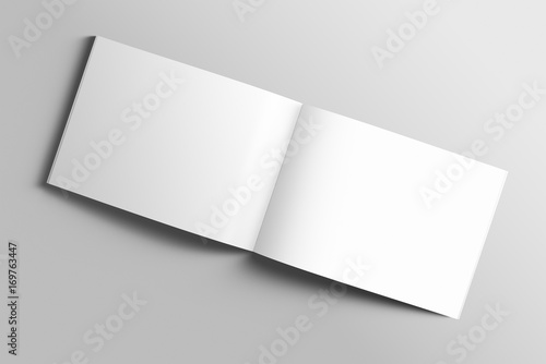 Fototapeta Naklejka Na Ścianę i Meble -  Blank A4 photorealistic landscape brochure mockup on light grey background. 