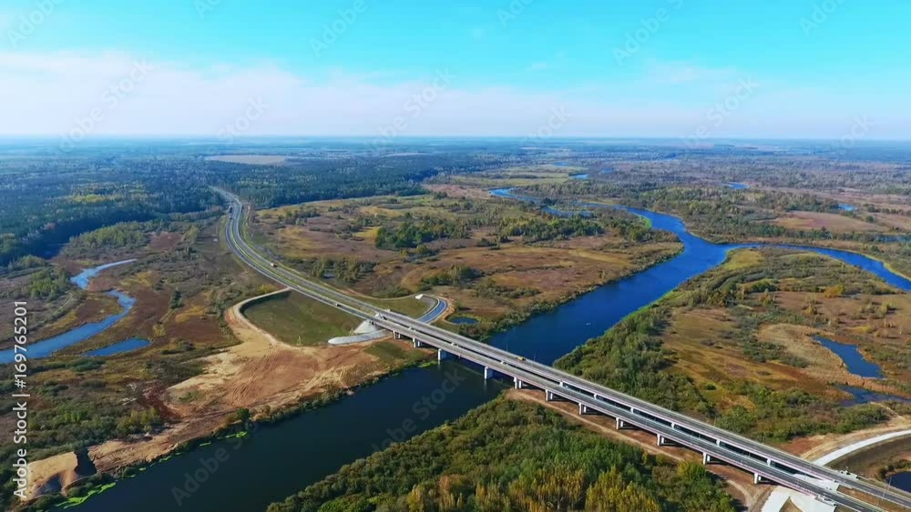 Highway road bridge over river. Aerial view of road bridge over water. Drone view of highway road landscape. Highway bridge. View from above. Road over river landscape Highway road bridge over river. Aerial view of road bridge over water. Drone view of highway road landscape. Highway bridge. View from above. Road over river landscape