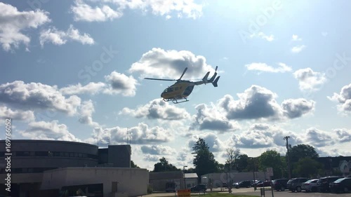 Medical Evac Helicopter hovering over a suburban community  photo