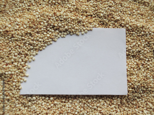 closeup white paper on raw cous cous semolina