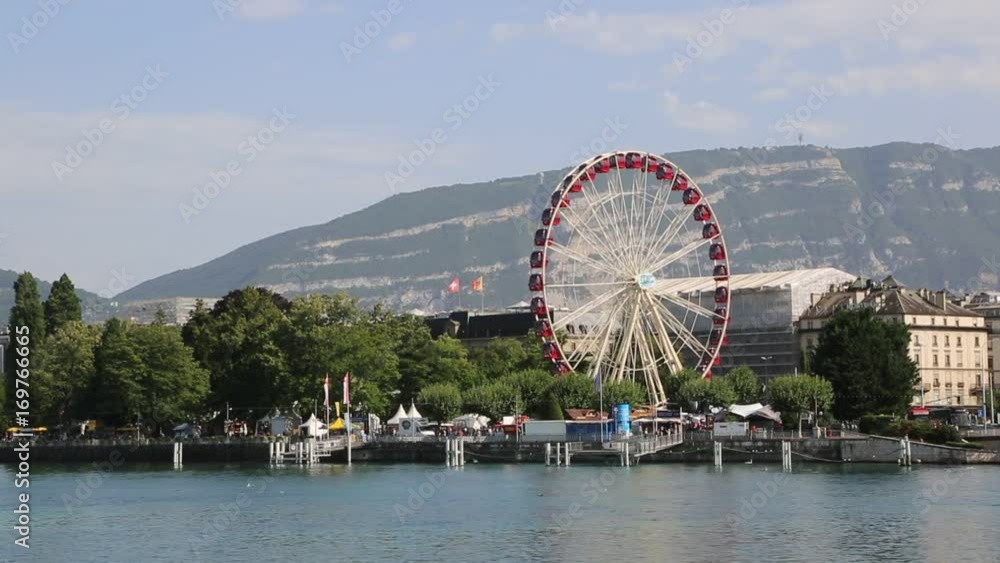 Ferris wheel in Geneva in a beautiful summer day, Switzerland Ferris wheel in Geneva in a beautiful summer day, Switzerland