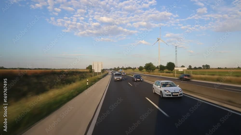 MUNICH, GERMANY - JULY 25, 2017: Asphalt road in Germany, Bavaria in a beautiful summer day MUNICH, GERMANY - JULY 25, 2017: Asphalt road in Germany, Bavaria in a beautiful summer day