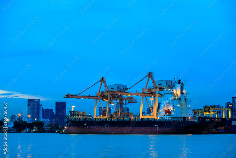 Shipping trade port. Container cargo ship loading or unloading by crane bridge. Logistics industrial and transportation business background