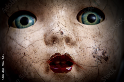 Photo Scary cracked old doll face