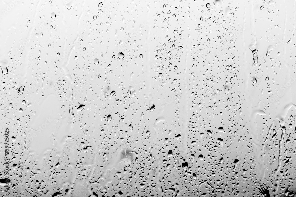 Naklejka premium Rain drops on the glass, background