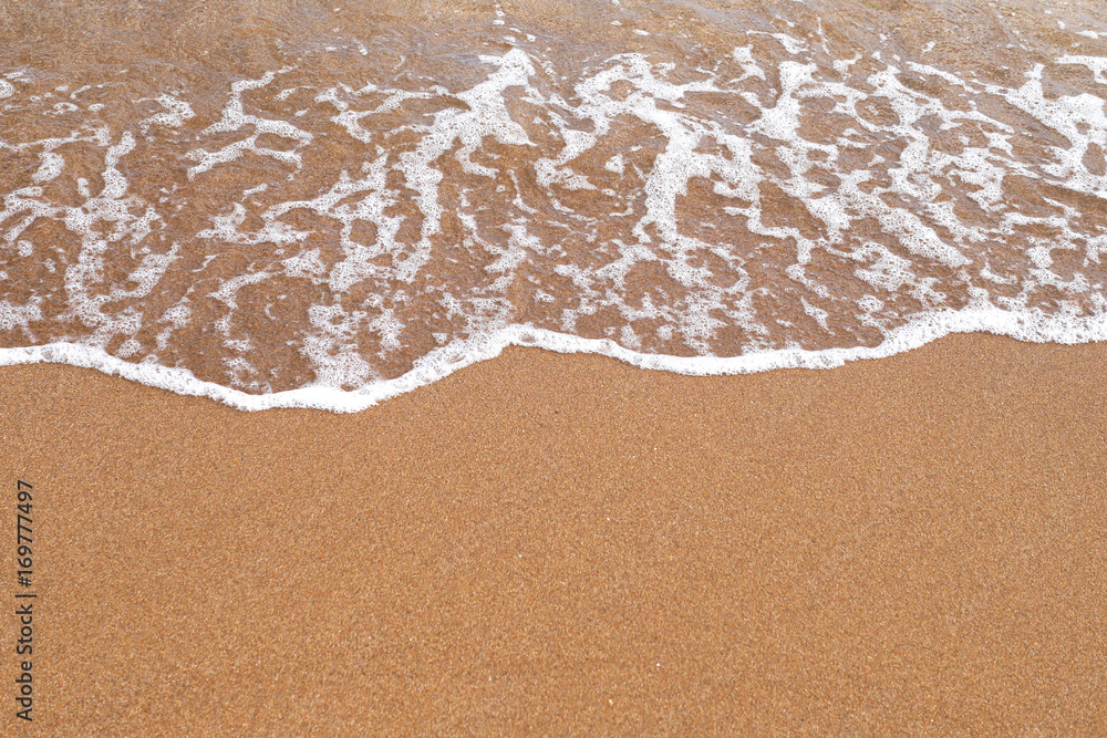 Sand beach. A sea wave on yellow sand. Abstract marine background. Sand beach. A sea wave on yellow sand. Abstract marine background.