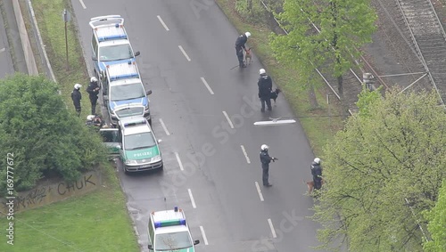 Police secures a demonstration near a railroad with dogs