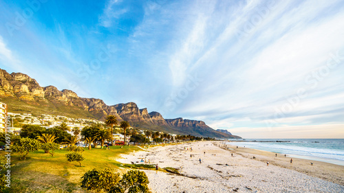 Camps Bay beach near Cape Town South Africa on a nice winter day, with the back of Table Mountain, called the twelve apostles, on the left photo