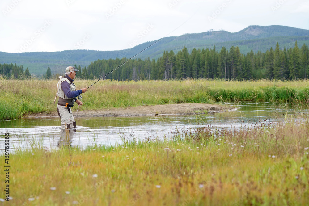 Fly-fisherman fishing in the Gallatin River, Montana