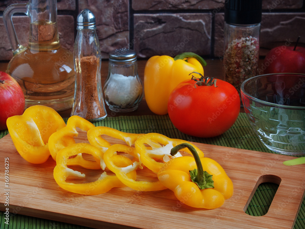Juicy sliced yellow pepper rings on the board Juicy sliced yellow pepper rings on the board
