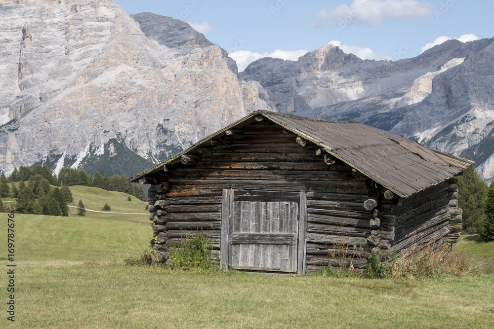Old wooden house in mountain. Dolomites, Italy Old wooden house in mountain. Dolomites, Italy