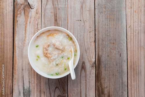 Thai rice porridge with pork on table,pork congee