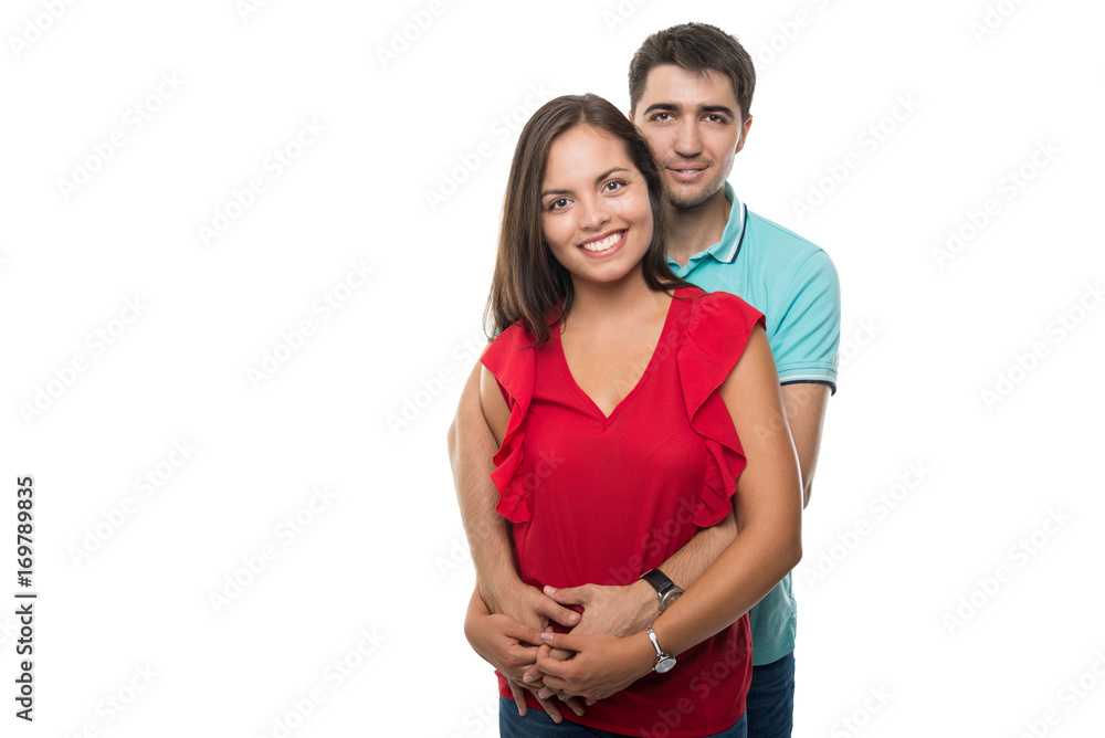 Attractive young couple embracing posing happy Attractive young couple embracing posing happy