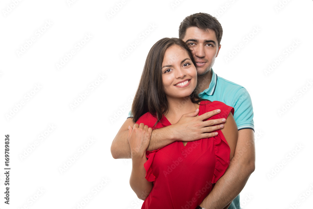 Attractive young couple hugging posing happy Attractive young couple hugging posing happy