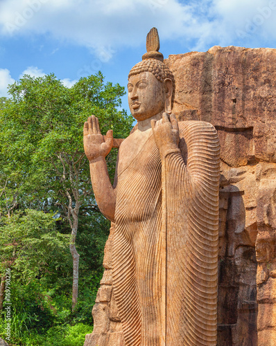 Full height Avukana statue is standing statue of Buddha. Sri Lanka, Kekirawa photo