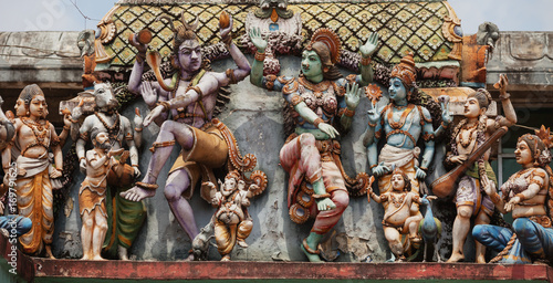 Decoration on the Hindu temple wall. Figures of dancing people