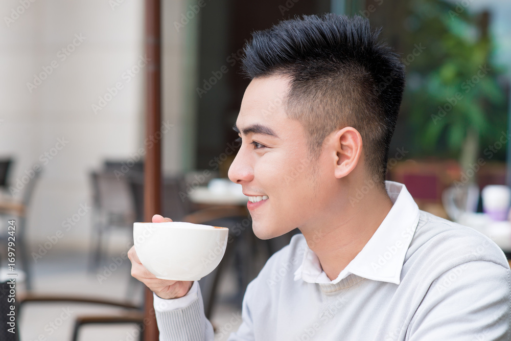 Happy businessman drinking coffee Happy businessman drinking coffee