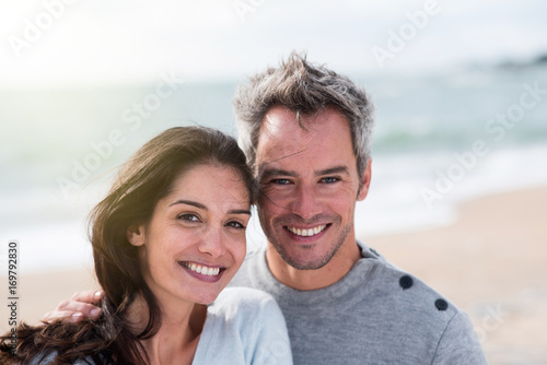 Portrait of a middle-aged couple having fun on the beach