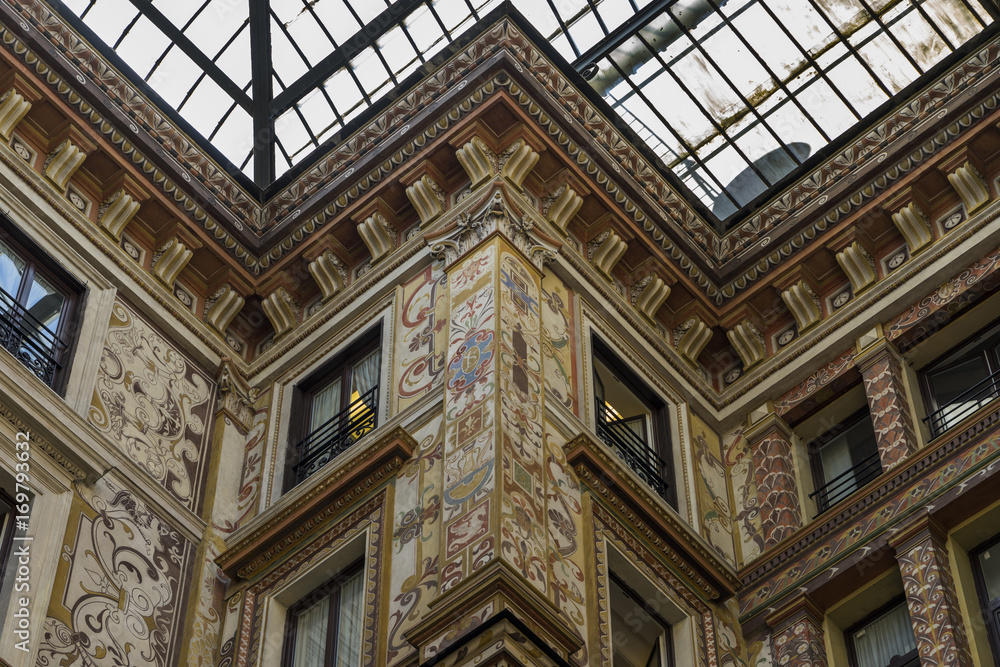 Ornately painted and decorated facades of the Galleria Sciarra.