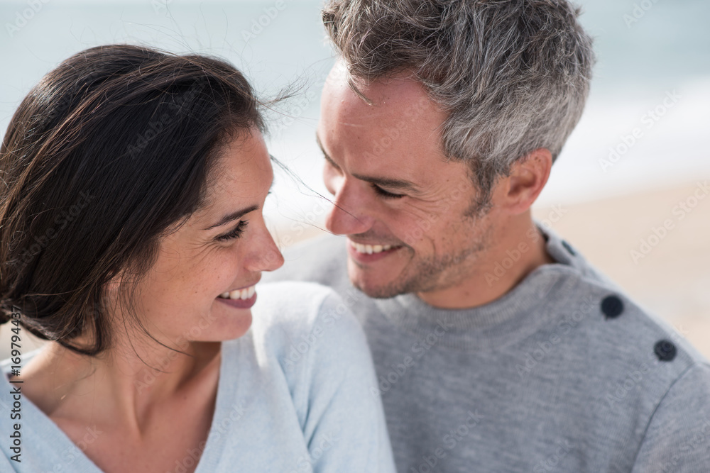 Portrait of a middle-aged couple having fun on the beach