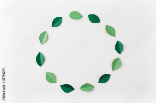round frame of green paper leaves