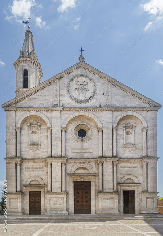 The stunning facade of the Duomo di Santa Maria Assunta cathedral, in the historic center of Pienza, Siena, Italy on a sunny day