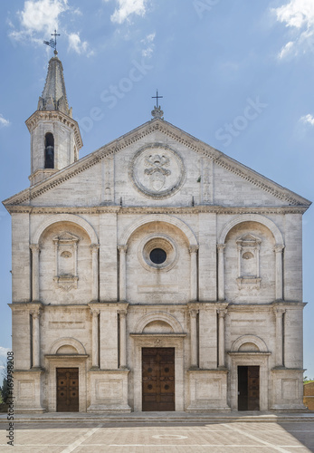 The stunning facade of the Duomo di Santa Maria Assunta cathedral, in the historic center of Pienza, Siena, Italy on a sunny day