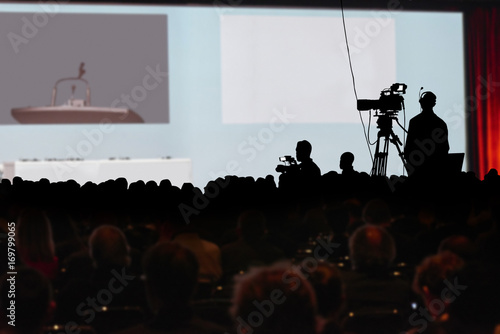 Conference production cameraman silhouette. Clipping path