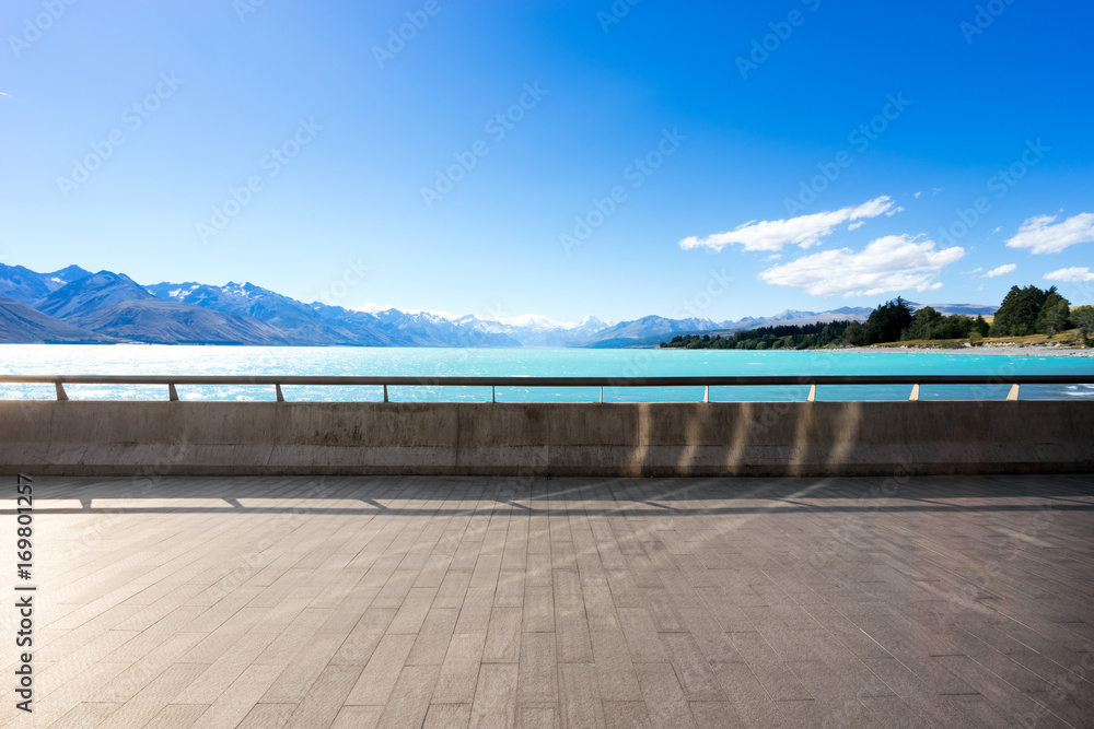 empty floor with beautiful lake in blue sky
