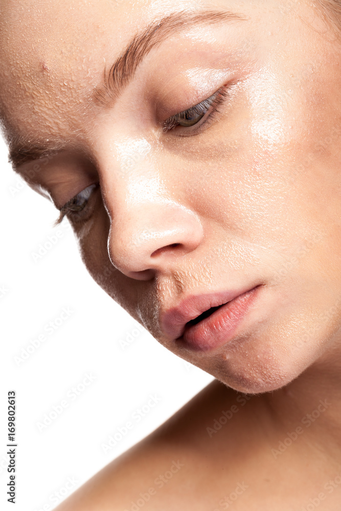 Obraz premium Gorgeous beautiful woman with wet face. Studio photo. Beauty and skin care