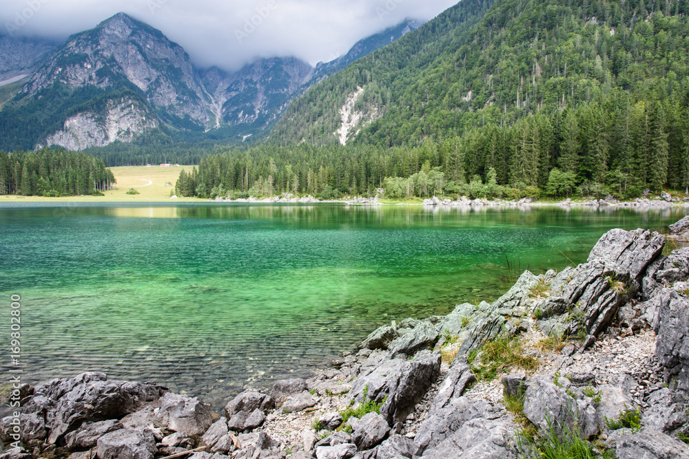 Fototapeta premium Upper Fusine Lake. Cradle in the mountains.