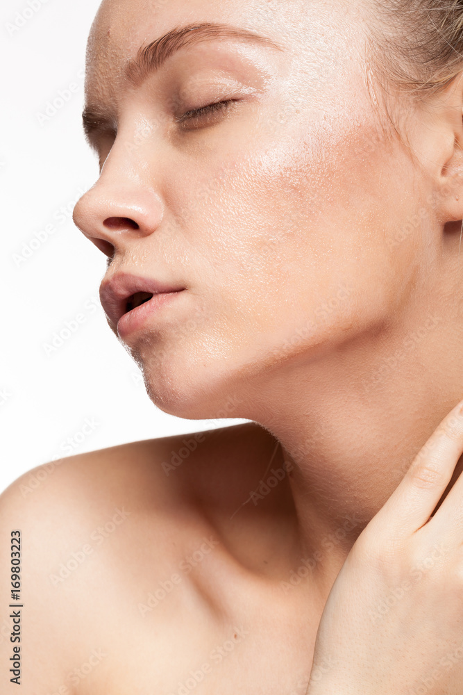 Gorgeous beautiful woman with wet face. Studio photo. Beauty and skin care Gorgeous beautiful woman with wet face. Studio photo. Beauty and skin care