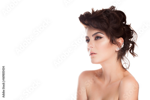 Gorgeous brunette model in studio photo isolated over white background. Perfect make up and hairstyle