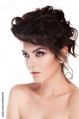 Gorgeous brunette model in studio photo isolated over white background. Perfect make up and hairstyle