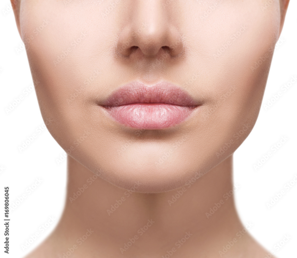 Perfect natural lips of young woman.