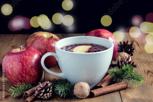 Autumn winter food concept Cup with hot cinnamone and apple tea Wooden background Above  photo