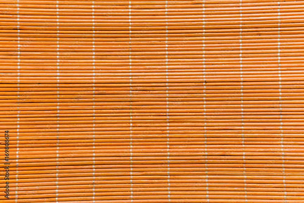 Bamboo wood orange texture with natural patterns mat texture can be used as background Bamboo wood orange texture with natural patterns mat texture can be used as background