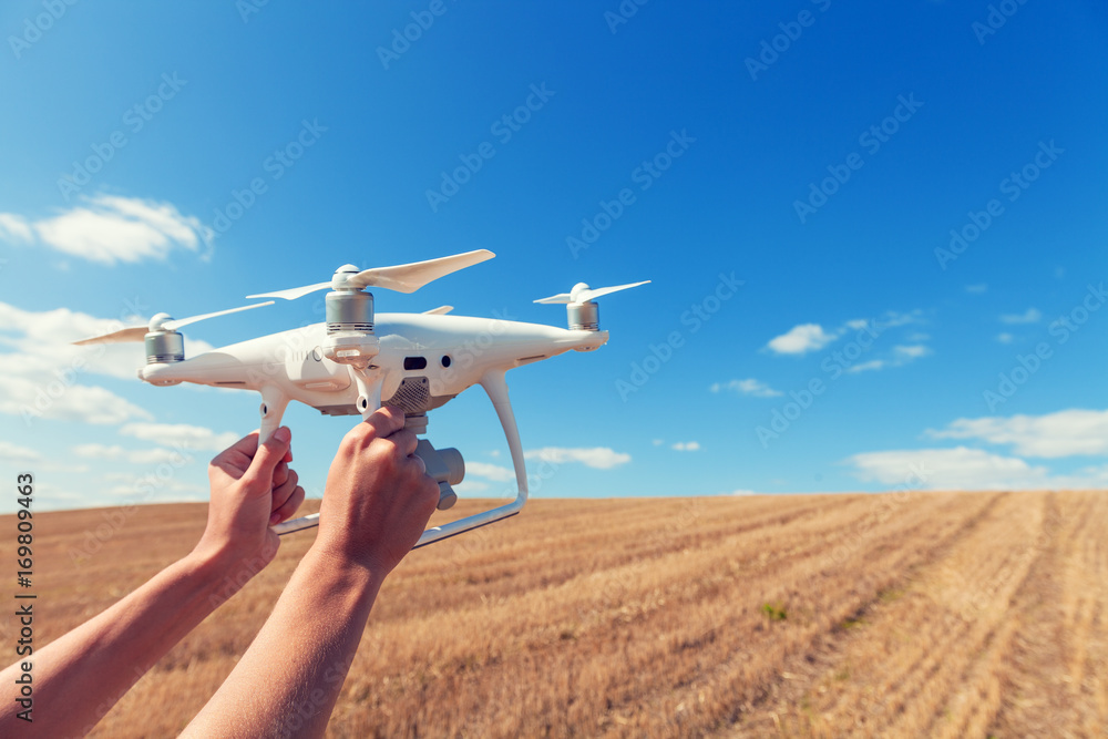 The drone and photographer woman hands The drone and photographer woman hands