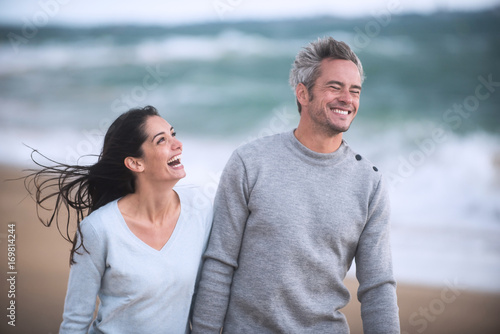 Portrait of a couple walking on the beach