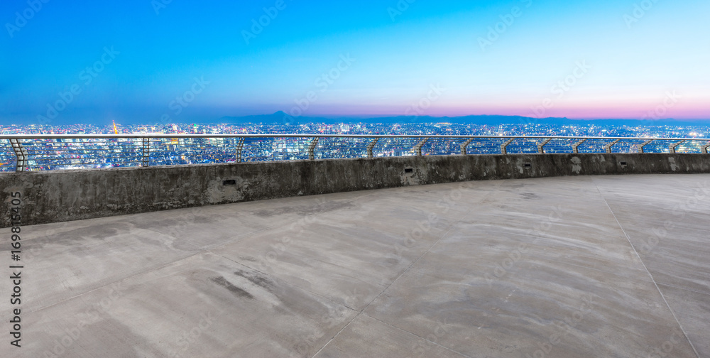 empty floor with cityscape of modern city in blue sky