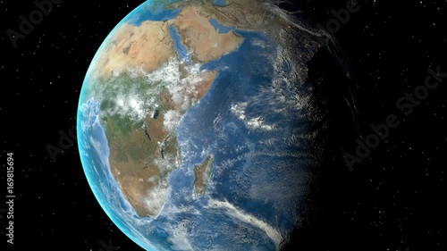 Night to day - rotating Earth. Zoom in on Tanzania outlined