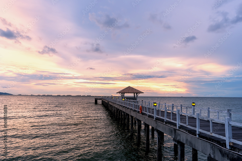 Summer, Travel, Holiday and Holiday concept - Wooden pier between sunset in Phuket, Thailand