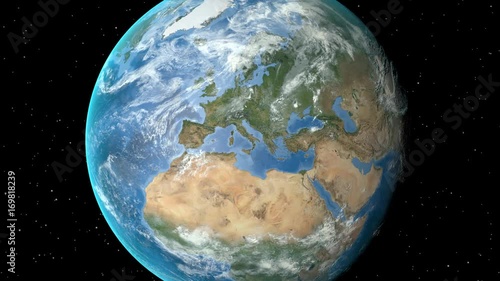 Night to day - rotating Earth. Zoom in on United Kingdom outlined