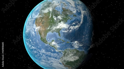 Night to day - rotating Earth. Zoom in on United States outlined