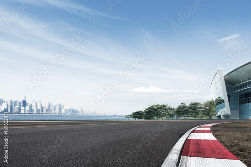 empty floor with cityscape of modern city in blue sky