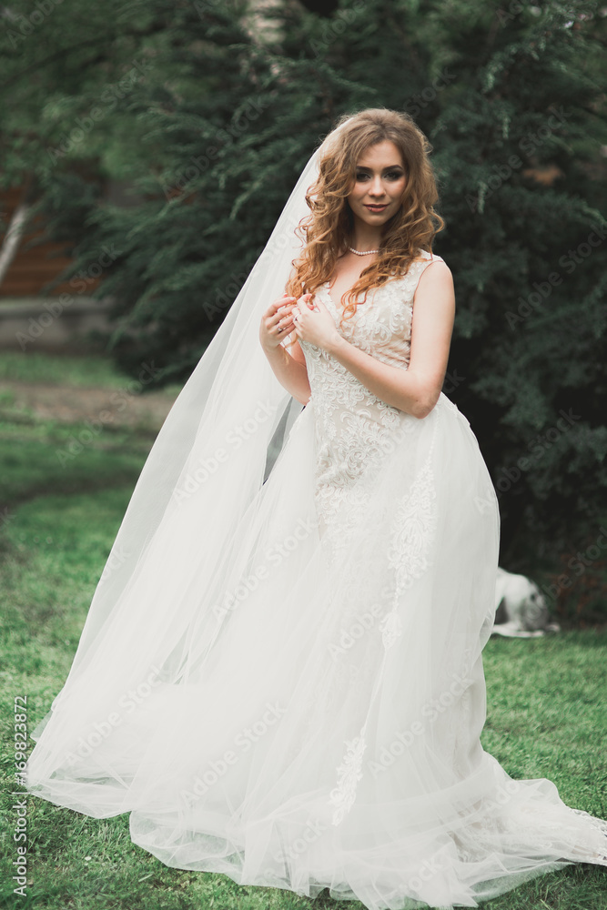 Bride. Beautiful young woman in the park on a warm summer day