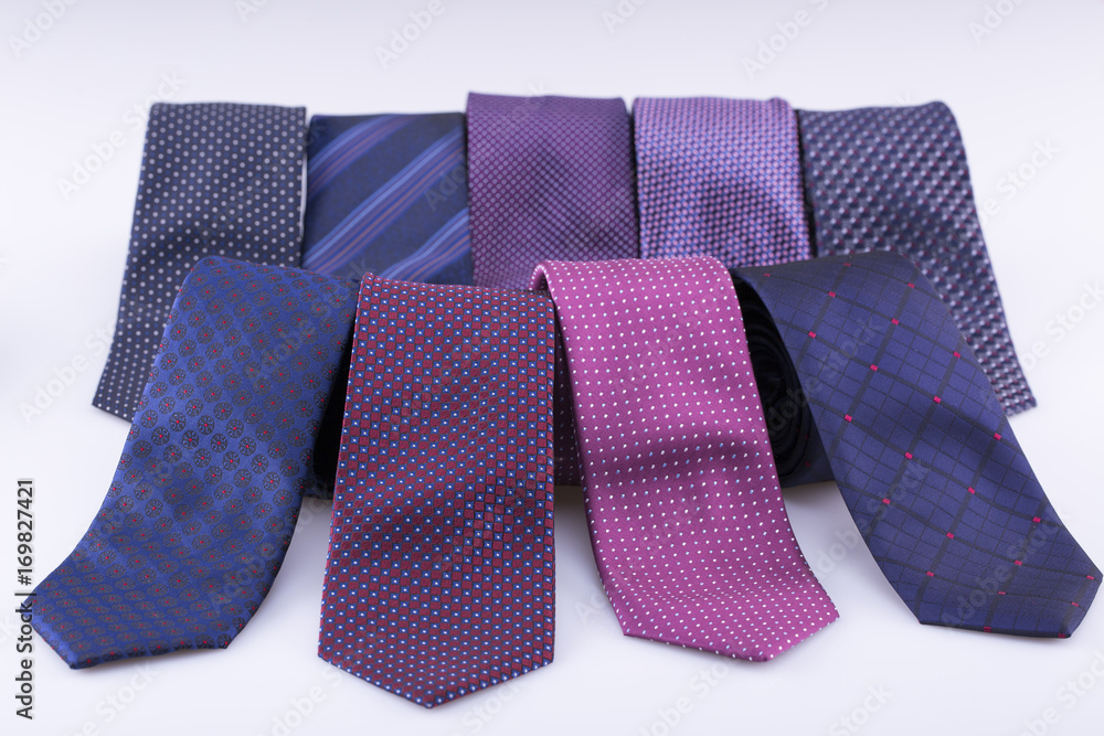 Beautiful silk ties are stacked together. Beautiful silk ties are stacked together.